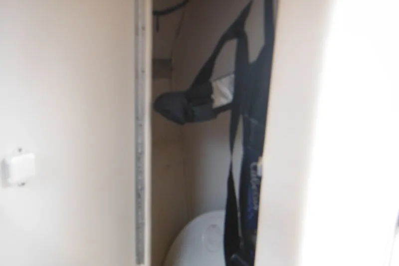 Slide: The Image of Interior storage compartment of 2004 Sea Ray 245 Weekender boat. - 47