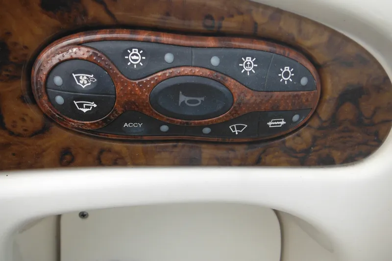 Slide: The Image of Control panel of a 2004 Sea Ray 245 Weekender boat with wood finish. - 58