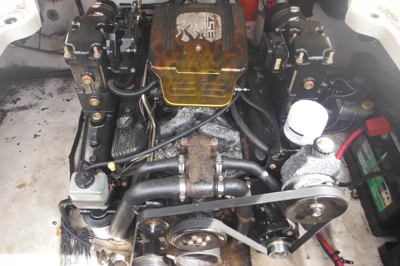 Slide: The Image of Engine compartment of a 2004 Sea Ray 245 Weekender boat, featuring a 357 MAG engine. - 33