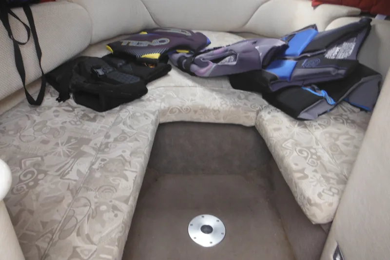 Slide: The Image of Interior cabin of a 2004 Sea Ray 245 Weekender with life jackets on seats. - 38