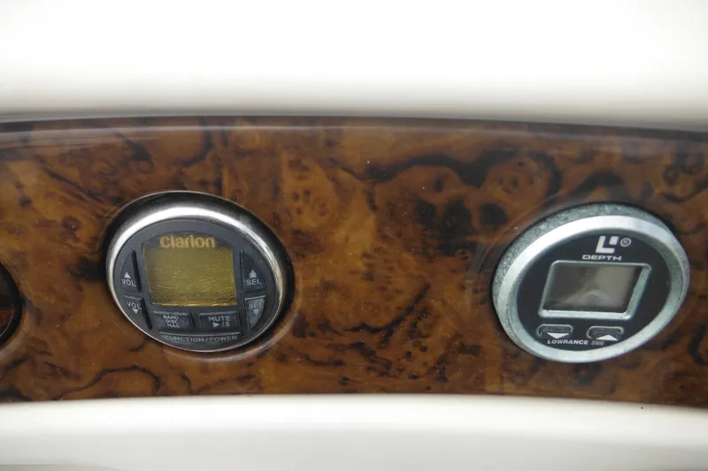 Slide: The Image of Dashboard of 2004 Sea Ray 245 Weekender with Clarion and Lowrance displays. - 59
