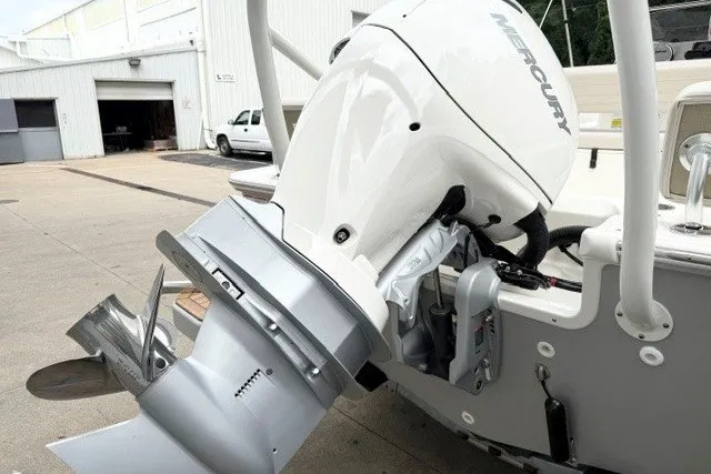 Slide: The Image of 2027 Boston Whaler 190 Montauk with Mercury outboard motor, docked at a marina. - 8