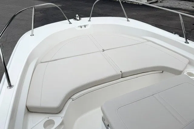 Slide: The Image of 2027 Boston Whaler 190 Montauk boat with cushioned seating area and stainless steel railings. - 7