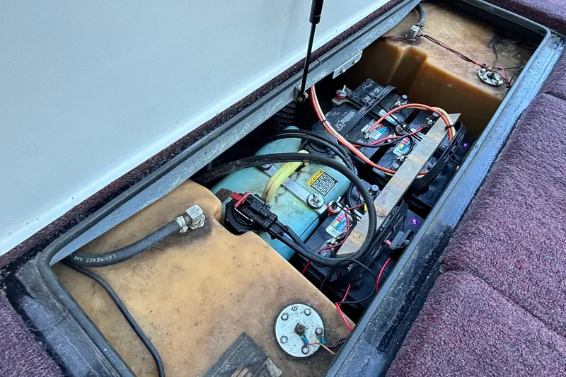 Slide: The Image of 1988 Ranger 375V boat battery compartment with wiring and components. - 12
