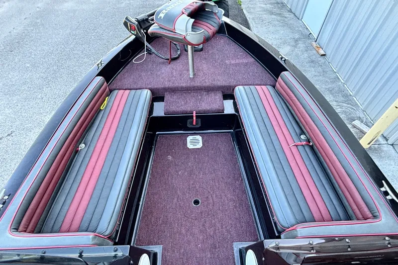 Slide: The Image of 1988 Ranger 375V boat interior with red and gray seating, carpeted floor. - 6