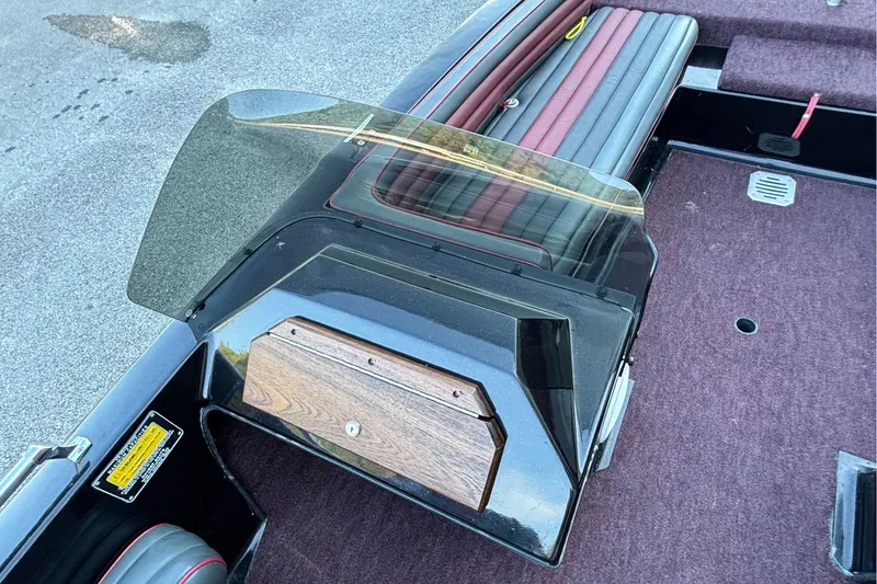 Slide: The Image of 1988 Ranger 375V boat interior with windshield and maroon seating. - 9