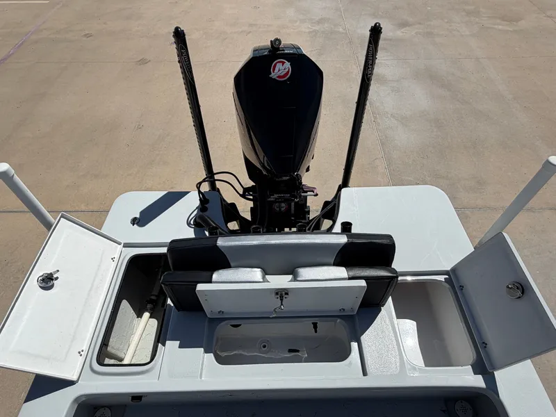 Slide: The Image of The image shows the stern of a Blazer Bay 2220 GTS boat with an outboard motor. - 25