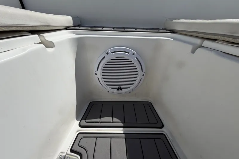 Slide: The Image of 1999 Boston Whaler 26 Outrage boat interior with speaker and cushioned seating. - 40