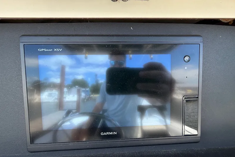 Slide: The Image of Garmin GPSMAP XSV on 1999 Boston Whaler 26 Outrage boat dashboard. - 23