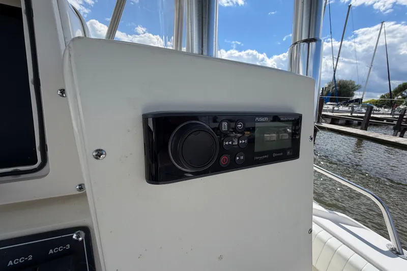 Slide: The Image of Control panel on a 1999 Boston Whaler 26 Outrage boat, dockside view. - 24