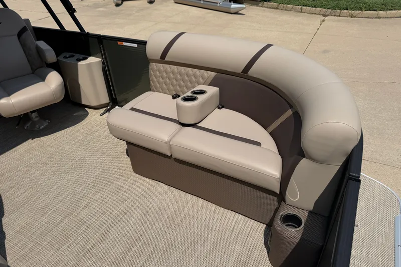 Slide: The Image of Luxurious seating on 2025 Crest Classic 200 pontoon boat with cup holders and plush upholstery. - 4