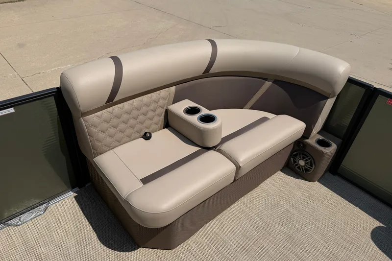Slide: The Image of Luxurious seating on 2025 Crest Classic 200 pontoon boat with cup holders and speaker. - 8