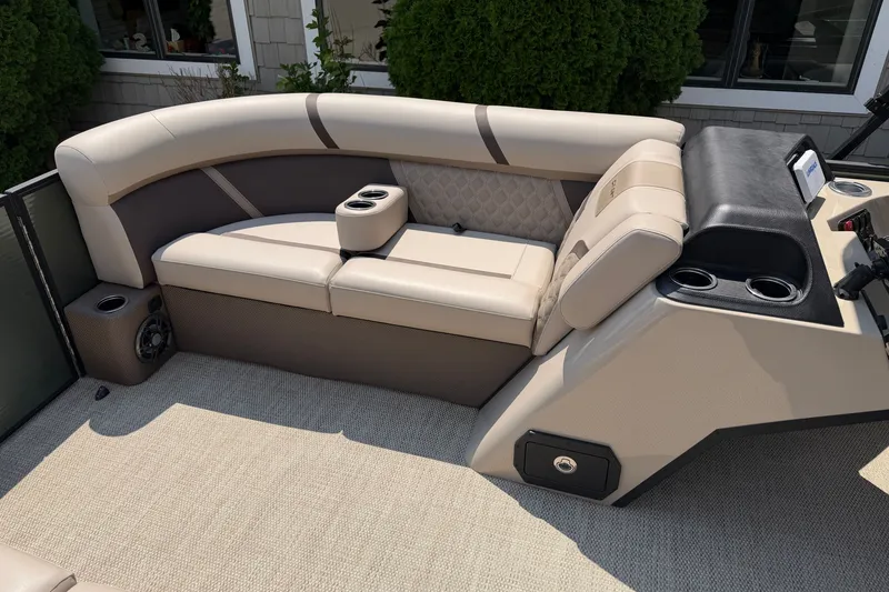 Slide: The Image of Luxurious seating on 2025 Crest Classic 200 pontoon boat with cup holders and modern design. - 7