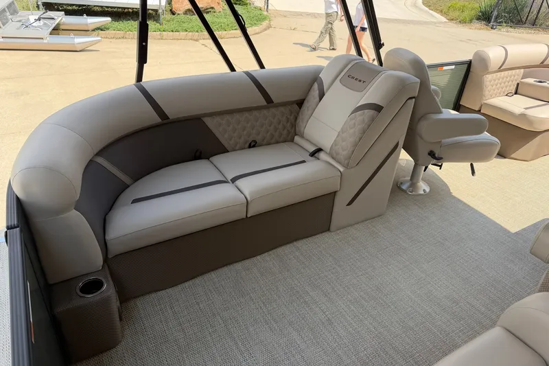 Slide: The Image of Luxurious seating on 2025 Crest Classic 200 pontoon boat, featuring elegant upholstery and spacious design. - 16