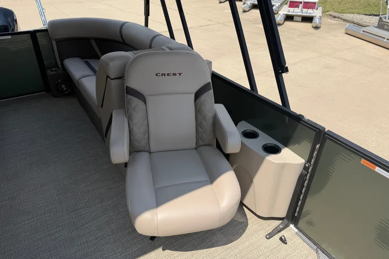 Slide: The Image of Luxurious seating on 2025 Crest Classic 200 boat with cup holders and elegant design. - 9
