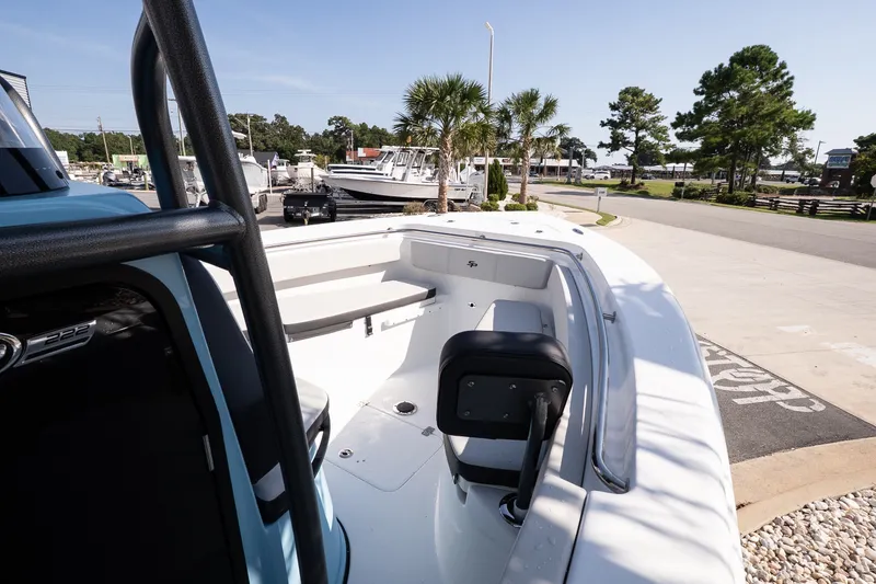 Slide: The Image of 2027 Sea Pro 222 Center Console boat docked, showcasing spacious seating and sleek design. - 14
