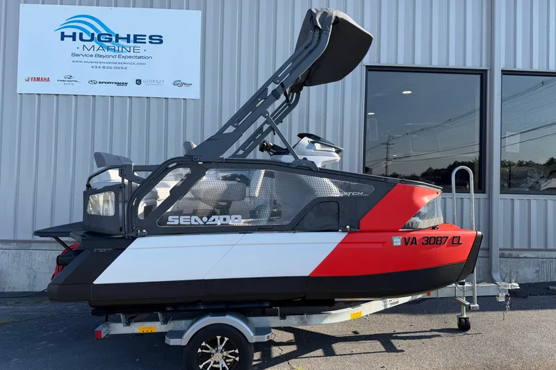 Slide: The Image of 2024 Sea-Doo Switch Compact on trailer outside Hughes Marine building. - 4