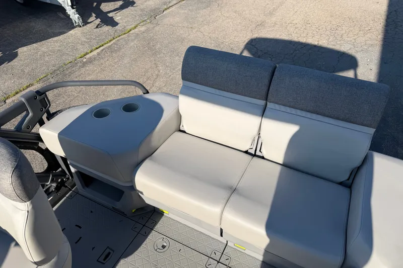 Slide: The Image of 2024 Sea-Doo Switch Compact interior seating with cup holders, showcasing modern design. - 6