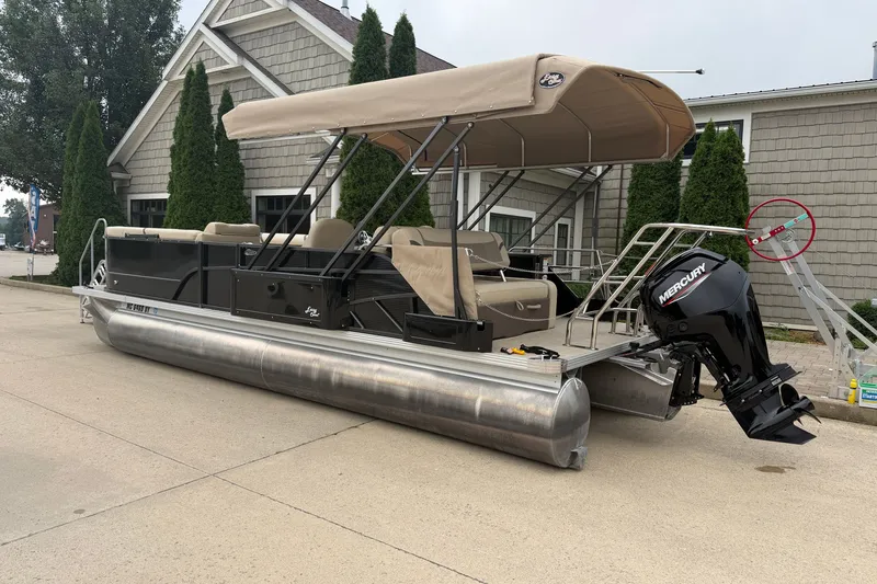 Slide: The Image of 2023 Crest Classic LX 240 SLSC pontoon boat with canopy and Mercury outboard motor. - 18
