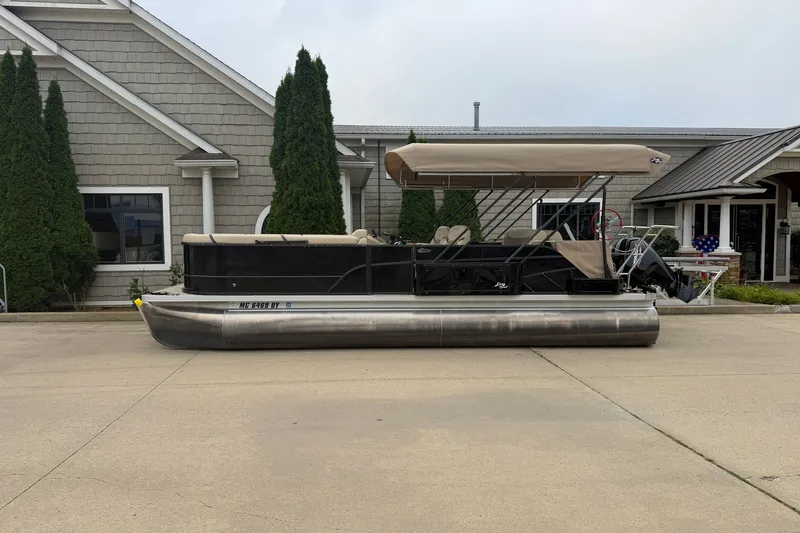The Image of 2023 Crest Classic LX 240 SLSC pontoon boat parked outside a building. - 0