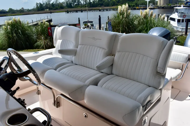Slide: The Image of Luxurious seating on a 2013 Grady-White Canyon 336 boat, with scenic waterfront view. - 55