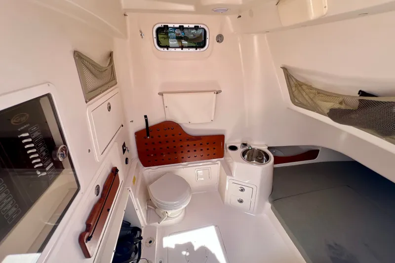 Slide: The Image of 2013 Grady-White Canyon 336 cabin interior with toilet and sink. - 37