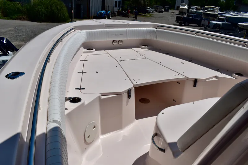Slide: The Image of 2013 Grady-White Canyon 336 boat interior, featuring spacious seating and storage compartments. - 57