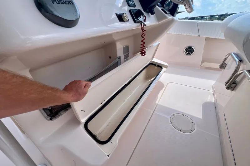 Slide: The Image of 2013 Grady-White Canyon 336 boat interior with open storage compartment. - 40