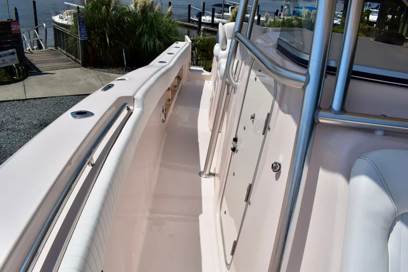 Slide: The Image of 2013 Grady-White Canyon 336 boat interior with sleek design and stainless steel features. - 65