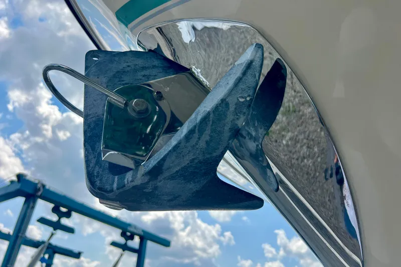 Slide: The Image of Anchor detail on 2013 Grady-White Canyon 336 boat under a cloudy sky. - 50
