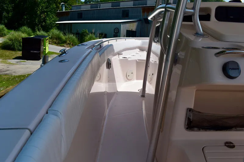 Slide: The Image of 2013 Grady-White Canyon 336 boat interior with white seating and stainless steel railings. - 56