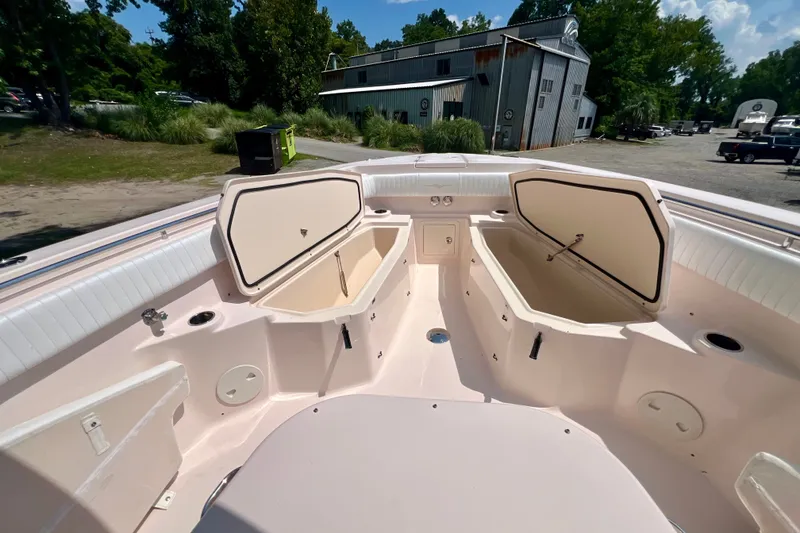 Slide: The Image of 2013 Grady-White Canyon 336 boat interior with open storage compartments. - 39