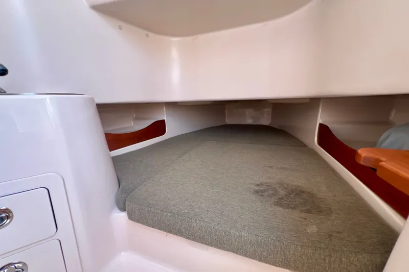 Slide: The Image of 2013 Grady-White Canyon 336 cabin interior with cushioned sleeping area. - 31