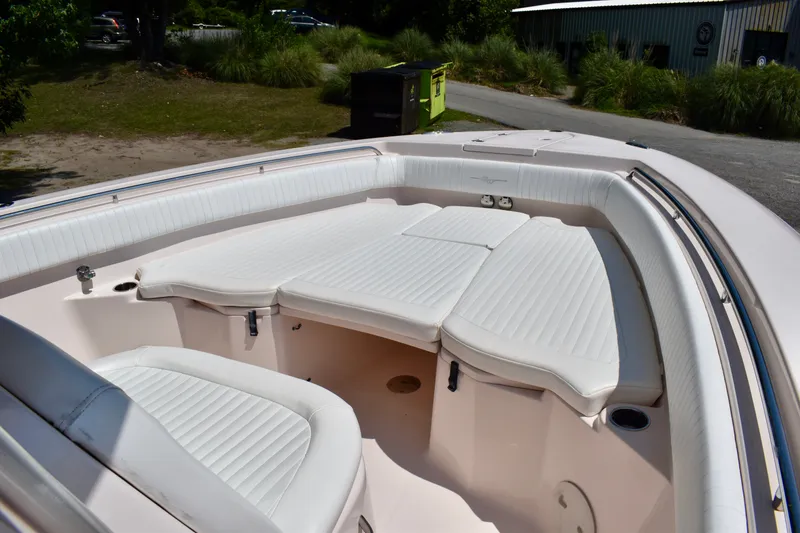 Slide: The Image of 2013 Grady-White Canyon 336 boat with white cushioned seating in the bow area. - 59