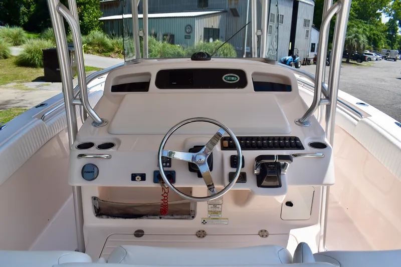 Slide: The Image of 2013 Grady-White Canyon 336 boat helm with steering wheel and controls. - 18