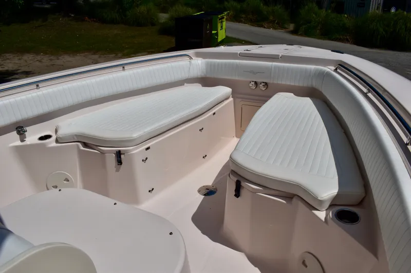 Slide: The Image of 2013 Grady-White Canyon 336 boat interior with white cushioned seating. - 67