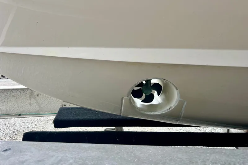 Slide: The Image of 2013 Grady-White Canyon 336 boat hull with visible bow thruster. - 49