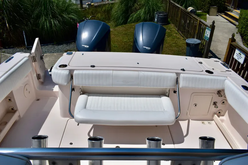 Slide: The Image of 2013 Grady-White Canyon 336 boat interior with seating and twin outboard engines. - 19