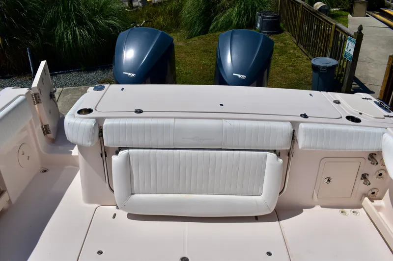 Slide: The Image of 2013 Grady-White Canyon 336 boat with dual outboard engines and white seating. - 51