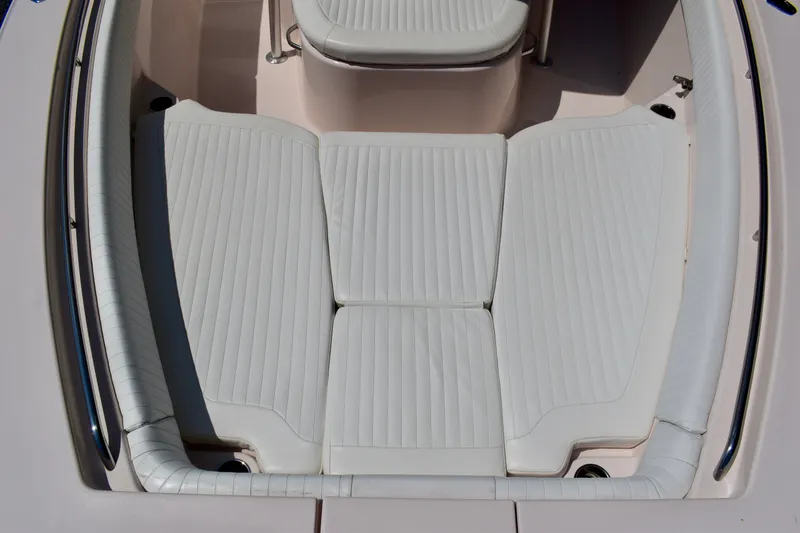 Slide: The Image of 2013 Grady-White Canyon 336 boat seating area with white cushioned seats. - 62