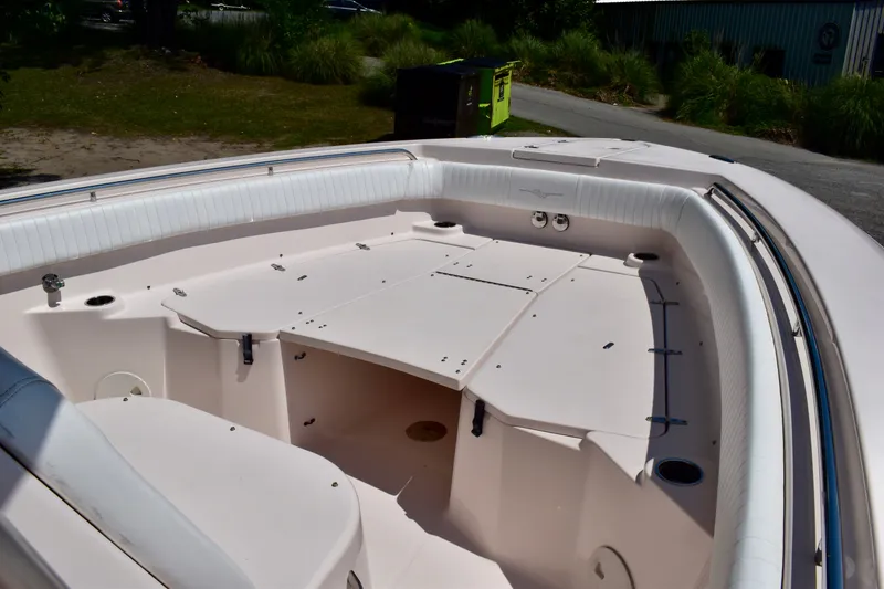 Slide: The Image of 2013 Grady-White Canyon 336 boat interior with seating and storage compartments. - 58