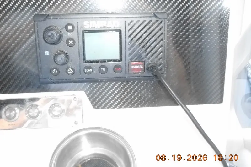 Slide: The Image of Simrad marine radio on Highfield Patrol 540, 2025 model, with carbon fiber panel. - 10