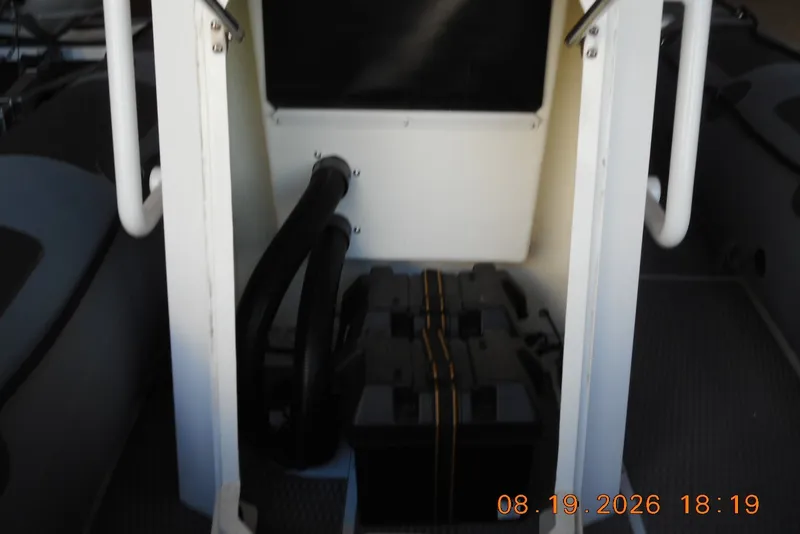 Slide: The Image of Interior view of a 2025 Highfield Patrol 540 boat, showing battery compartment. - 6