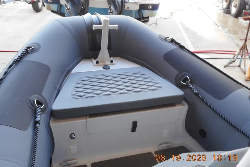 Slide: The Image of 2025 Highfield Patrol 540 inflatable boat interior with seating and rope details. - 5