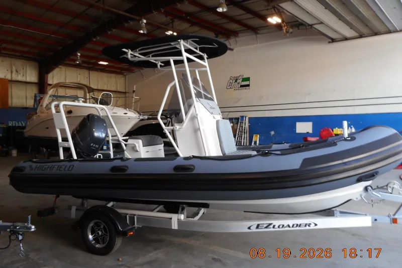 The Image of 2025 Highfield Patrol 540 boat on trailer in indoor storage facility. - 0