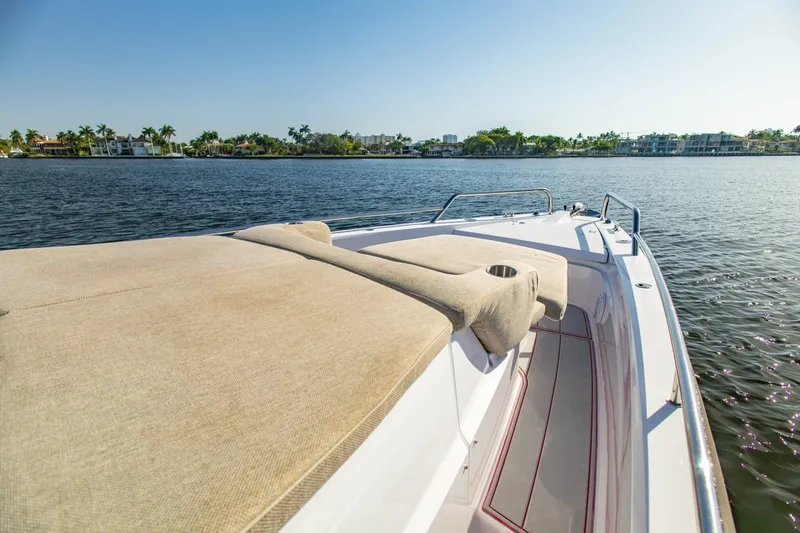 Slide: The Image of 2025 Axopar 37 Sun-Top boat with sunbed, cruising on a sunny day. - 27
