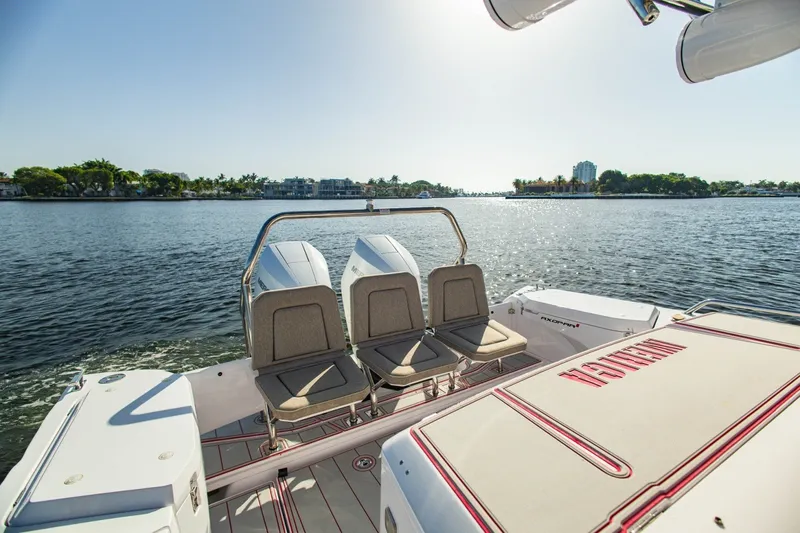 Slide: The Image of 2025 Axopar 37 Sun-Top boat with dual engines on a sunny day. - 15