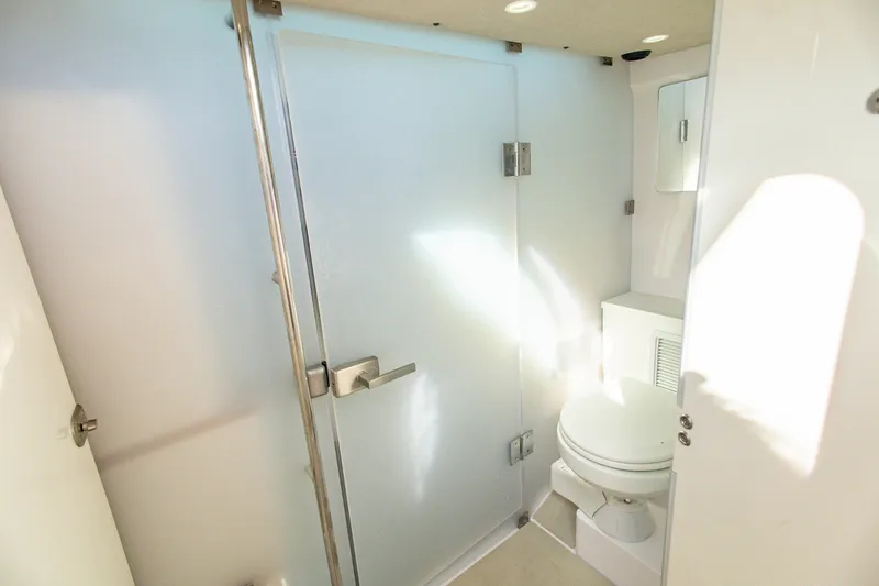 Slide: The Image of 2025 Axopar 37 Sun-Top boat bathroom with modern fixtures and sleek design. - 33