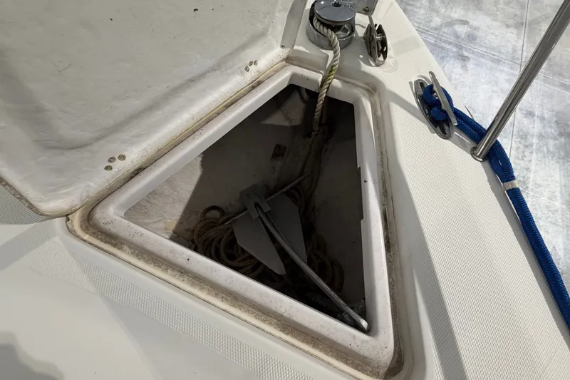 Slide: The Image of Anchor compartment of a 2007 Donzi 29 ZF Cuddy boat with rope and anchor. - 22