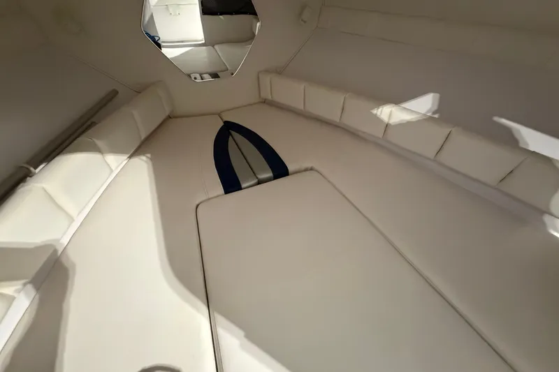 Slide: The Image of 2007 Donzi 29 ZF Cuddy cabin interior with white cushioned seating. - 20